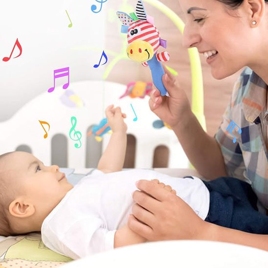 Hochet bebe avec un bebe qui est content